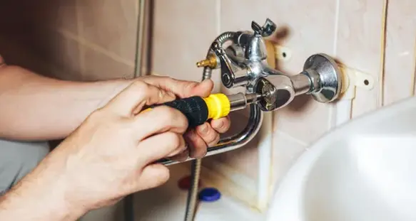 Plumber Installing the Sink